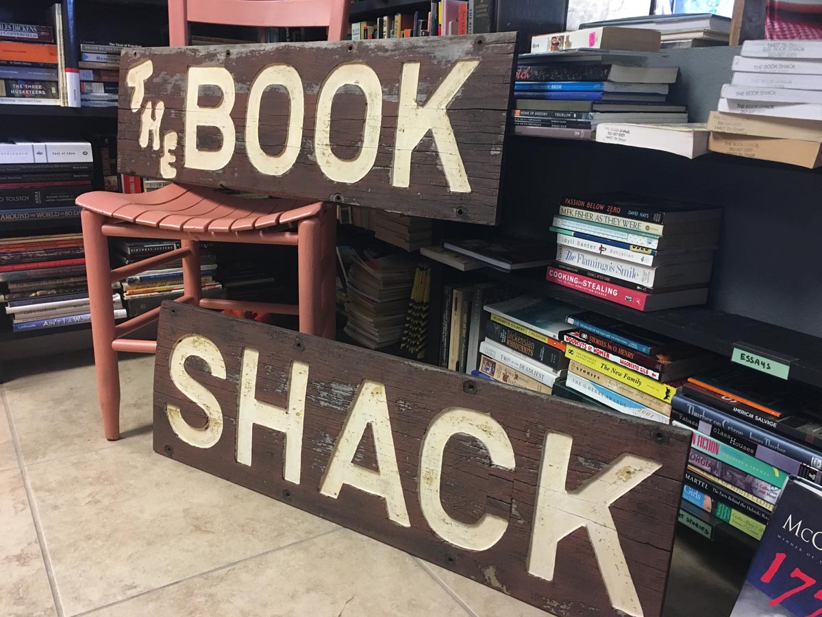 wooden bookshack sign